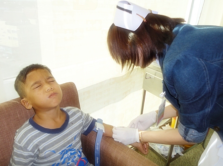 The youngest boy at the Children’s Home was not too happy with his nurse.